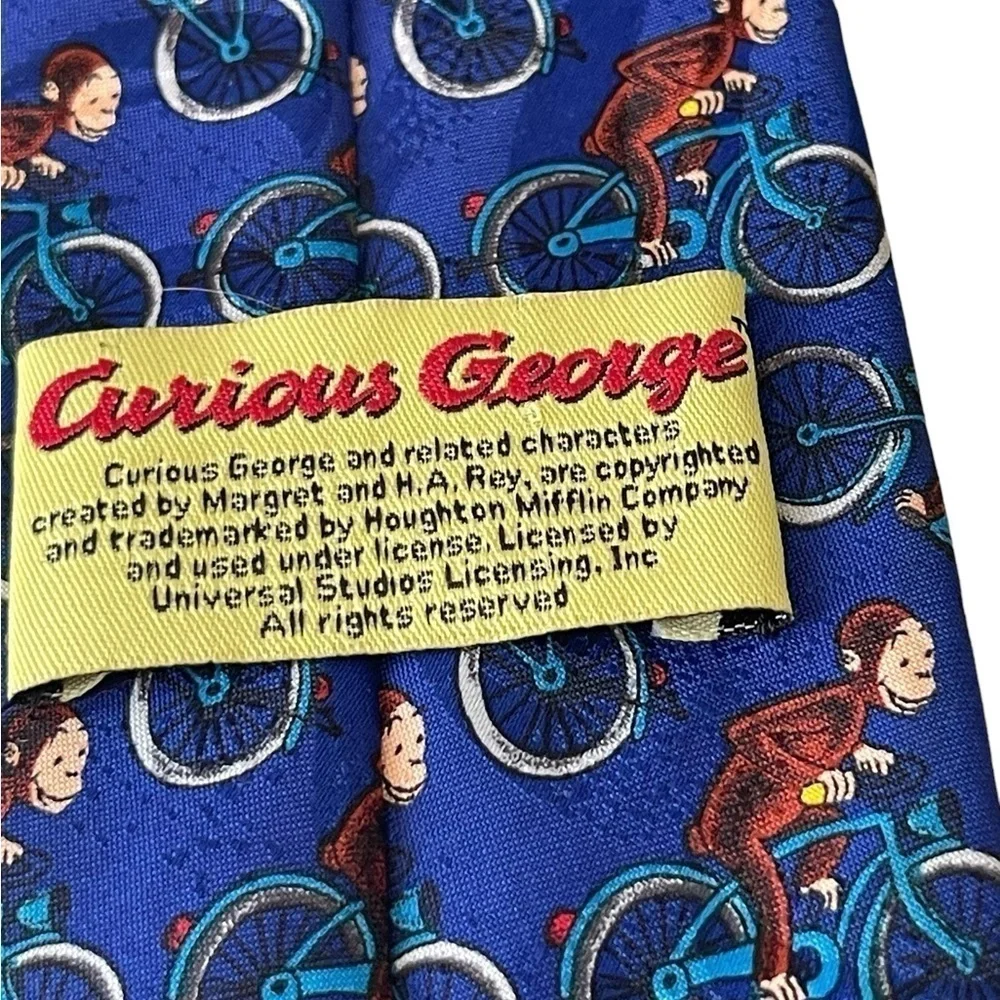 Curious George men’s tie 100% Polyester George on a bicycle Novelty Tie blue